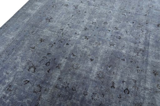 Backside of handmade 1950s Mashad rug showing knot structure and weave density