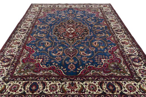 Surface texture of 2000s Mashad rug with natural Wool and intricate pattern
