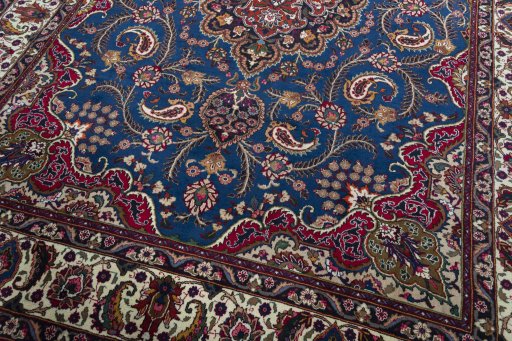 Close-up detail of 2000s Mashad rug from Iran / Persia showing Wool weave
