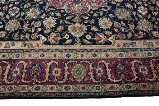 Corner detail of 1970s Mashad rug showing border pattern and Wool pile