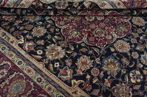Close-up detail of 1970s Mashad rug from Iran / Persia showing Wool weave