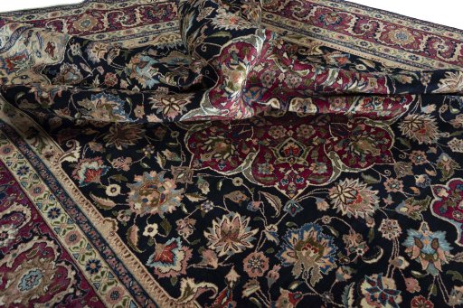 Surface texture of 1970s Mashad rug with natural Wool and intricate pattern