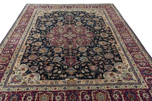 Surface texture of 1970s Mashad rug with natural Wool and intricate pattern