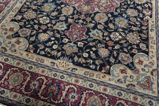 Close-up detail of 1970s Mashad rug from Iran / Persia showing Wool weave