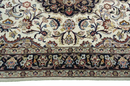 Corner detail of 2000s Mashad rug showing border pattern and Wool pile