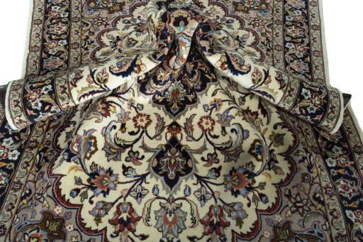 Surface texture of 2000s Mashad rug with natural Wool and intricate pattern
