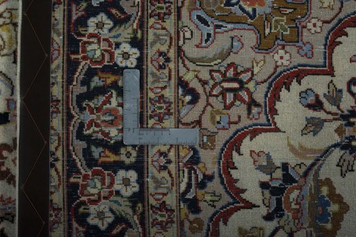Backside of handmade 2000s Mashad rug showing knot structure and weave density