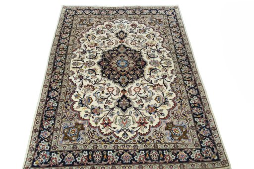 Surface texture of 2000s Mashad rug with natural Wool and intricate pattern