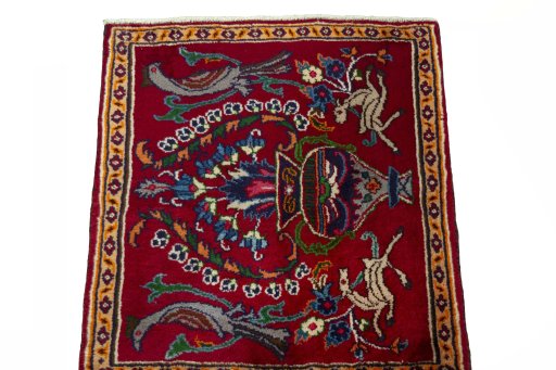 Surface texture of 2000s Mashad rug with natural Wool and intricate pattern