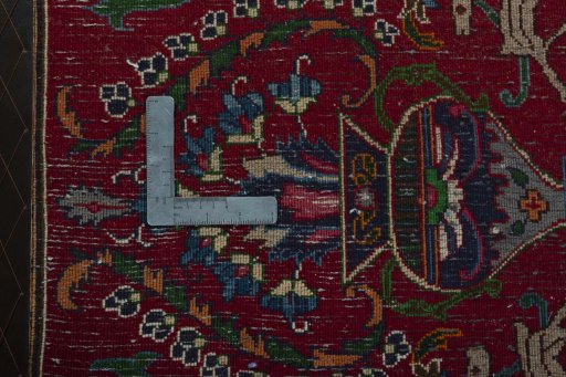 Backside of handmade 2000s Mashad rug showing knot structure and weave density