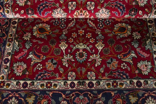 Close-up detail of 2000s Mashad rug from Iran / Persia showing Wool weave