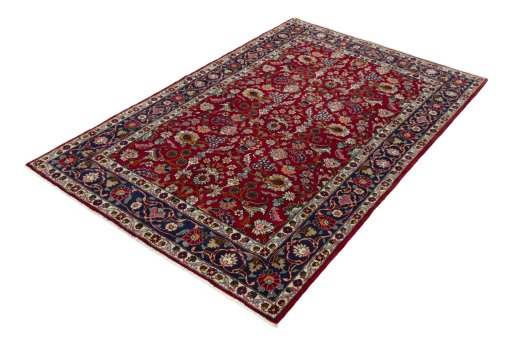Corner detail of 2000s Mashad rug showing border pattern and Wool pile