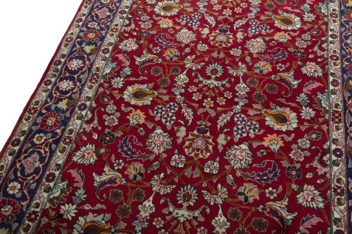Backside of handmade 2000s Mashad rug showing knot structure and weave density