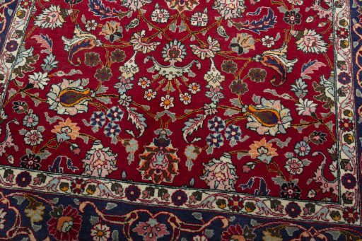 Close-up detail of 2000s Mashad rug from Iran / Persia showing Wool weave