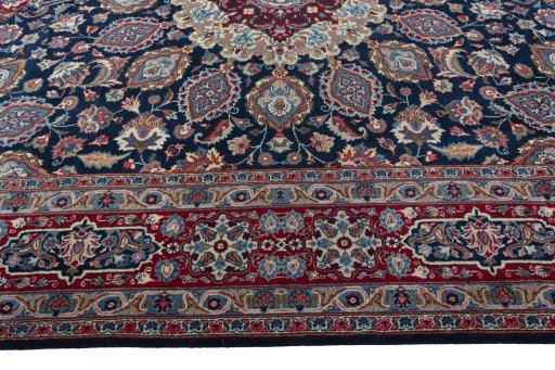 Corner detail of 1970s Mashad rug showing border pattern and Wool pile