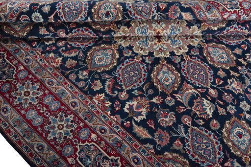Close-up detail of 1970s Mashad rug from Iran / Persia showing Wool weave