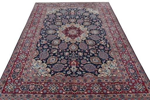 Surface texture of 1970s Mashad rug with natural Wool and intricate pattern