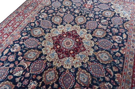 Backside of handmade 1970s Mashad rug showing knot structure and weave density