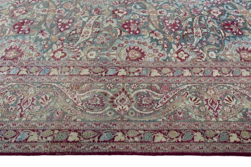 Corner detail of 1950s Mashad rug showing border pattern and Wool pile