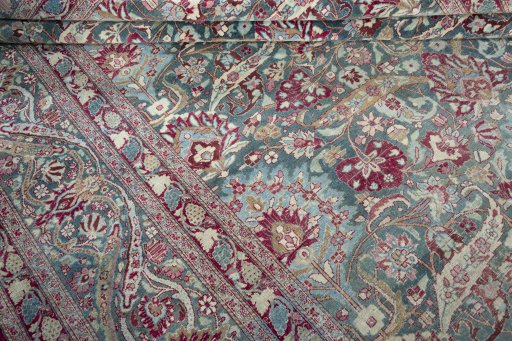 Close-up detail of 1950s Mashad rug from Iran / Persia showing Wool weave