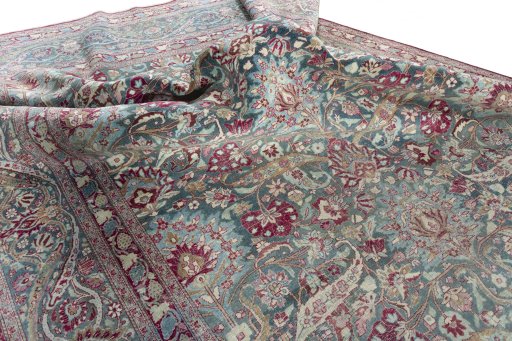 Surface texture of 1950s Mashad rug with natural Wool and intricate pattern