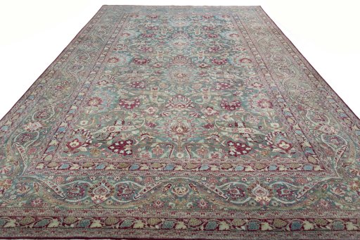 Surface texture of 1950s Mashad rug with natural Wool and intricate pattern