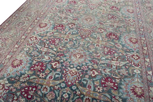Backside of handmade 1950s Mashad rug showing knot structure and weave density