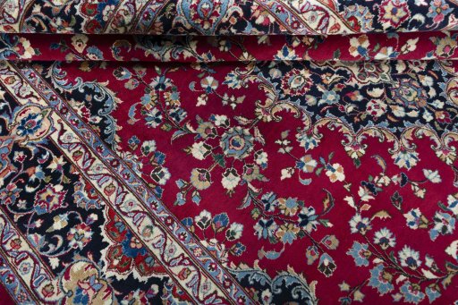 Close-up detail of 2000s Mashad rug from Iran / Persia showing Wool weave
