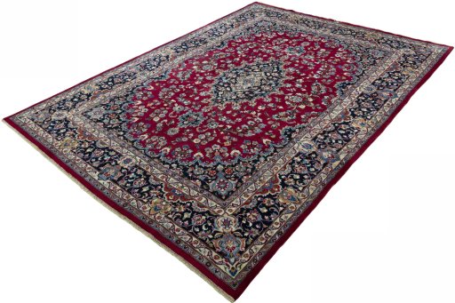 Corner detail of 2000s Mashad rug showing border pattern and Wool pile
