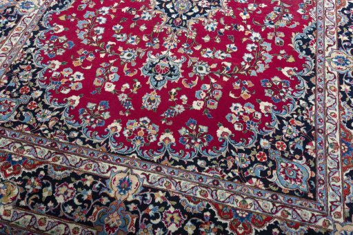 Close-up detail of 2000s Mashad rug from Iran / Persia showing Wool weave