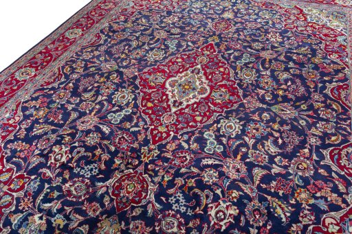 Backside of handmade 2000s Mashad rug showing knot structure and weave density