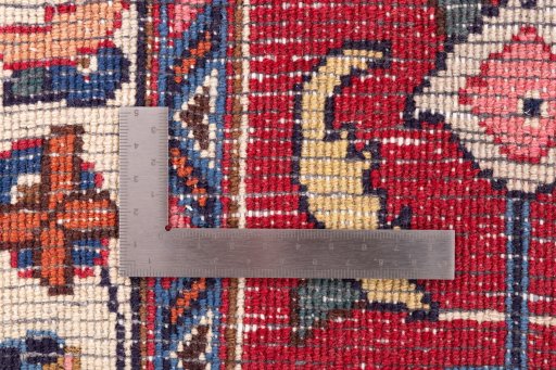 Backside of handmade 1990s Mashad rug showing knot structure and weave density