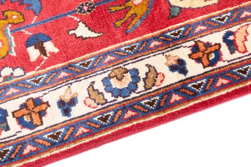 Backside of handmade 1990s Mashad rug showing knot structure and weave density