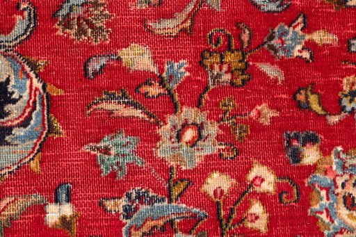 Close-up detail of 2000s Mashad rug from Iran / Persia showing Wool weave