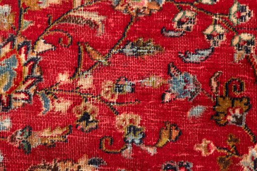 Surface texture of 2000s Mashad rug with natural Wool and intricate pattern