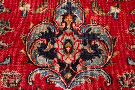 Backside of handmade 2000s Mashad rug showing knot structure and weave density