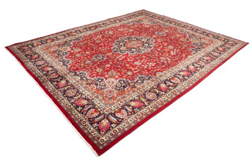 Corner detail of 2000s Mashad rug showing border pattern and Wool pile