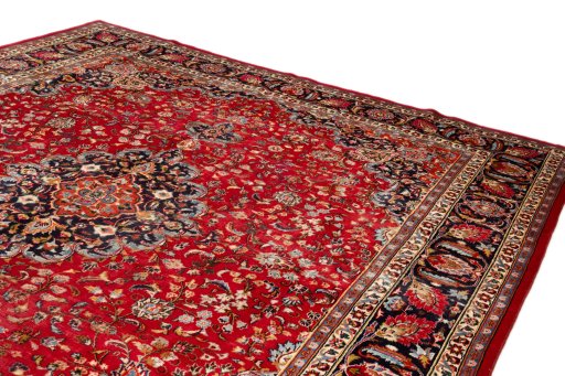 Surface texture of 2000s Mashad rug with natural Wool and intricate pattern