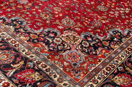 Backside of handmade 2000s Mashad rug showing knot structure and weave density