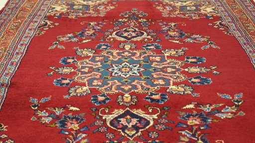 Close-up detail of 2000s Mashad rug from Iran / Persia showing Wool weave