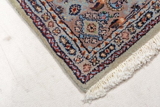 Backside of handmade New Moud rug showing knot structure and weave density