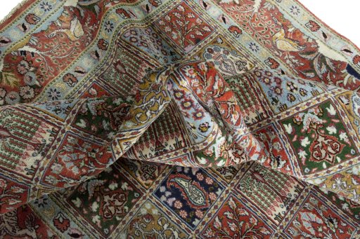 Corner detail of 2000s Moud rug showing border pattern and Wool pile