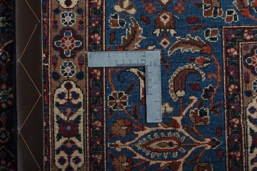 Backside of handmade New Moud rug showing knot structure and weave density