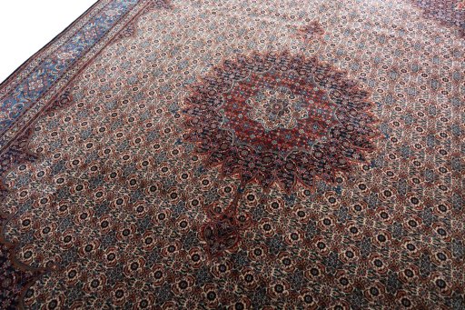 Backside of handmade New Moud rug showing knot structure and weave density
