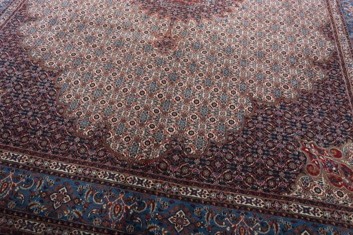 Close-up detail of New Moud rug from Iran / Persia showing Wool weave