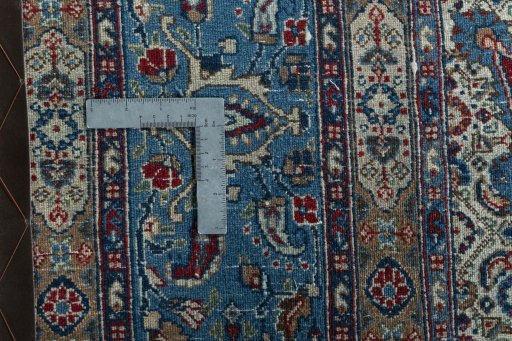 Backside of handmade 2000s Moud rug showing knot structure and weave density
