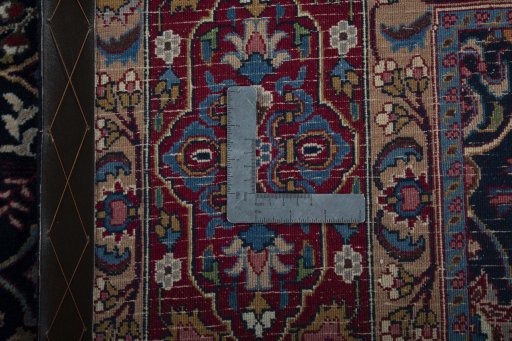 Surface texture of 1970s Moud rug with natural Wool and intricate pattern