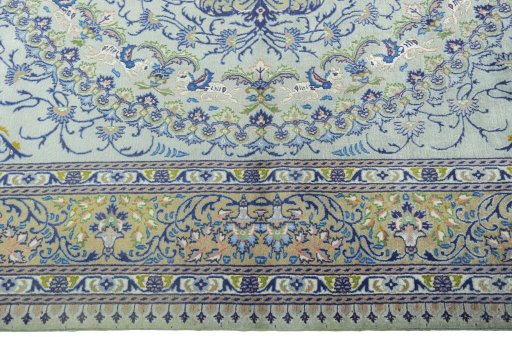 Corner detail of 2000s Moud rug showing border pattern and Wool pile