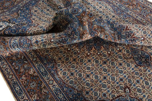 Surface texture of 2000s Moud rug with natural Wool and intricate pattern