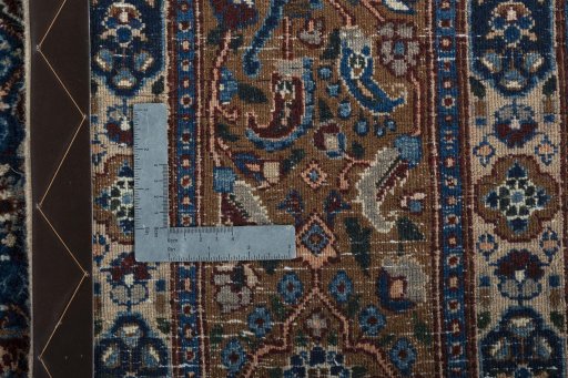 Backside of handmade 2000s Moud rug showing knot structure and weave density